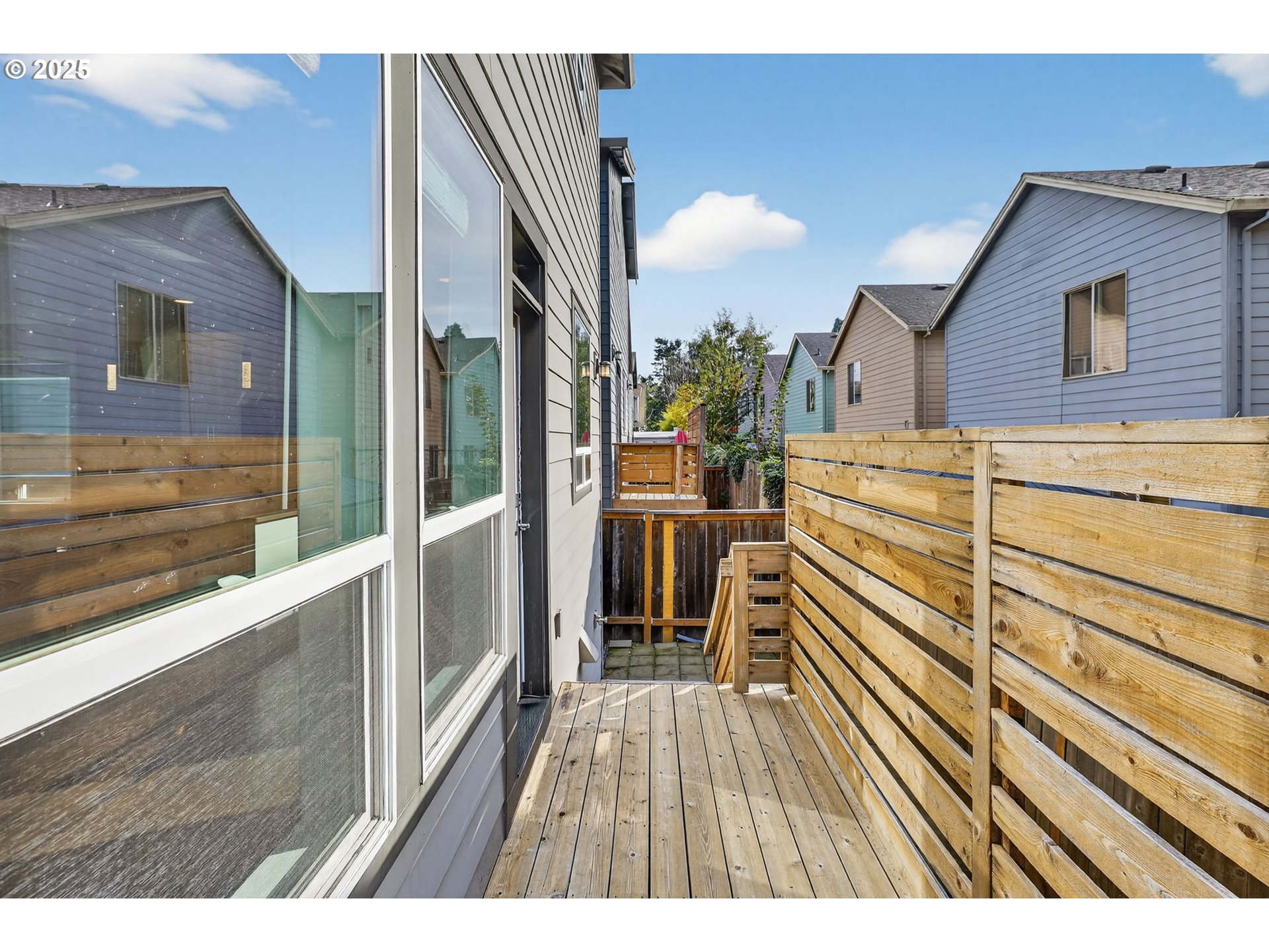 7830 Southeast Boise Court Portland, OR 97206 - Photo 8 of 48 a view of a balcony with wooden floor and iron