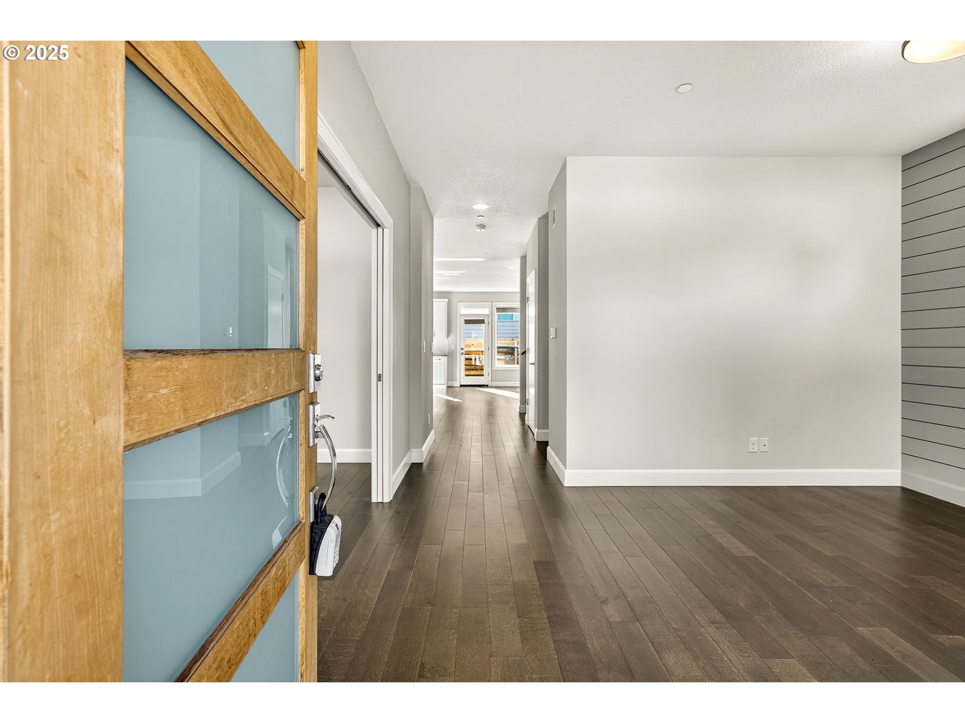 7830 Southeast Boise Court Portland, OR 97206 - Photo 10 of 48 a view of an empty room with wooden floor