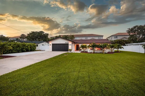 a front view of house with yard and entertaining space
