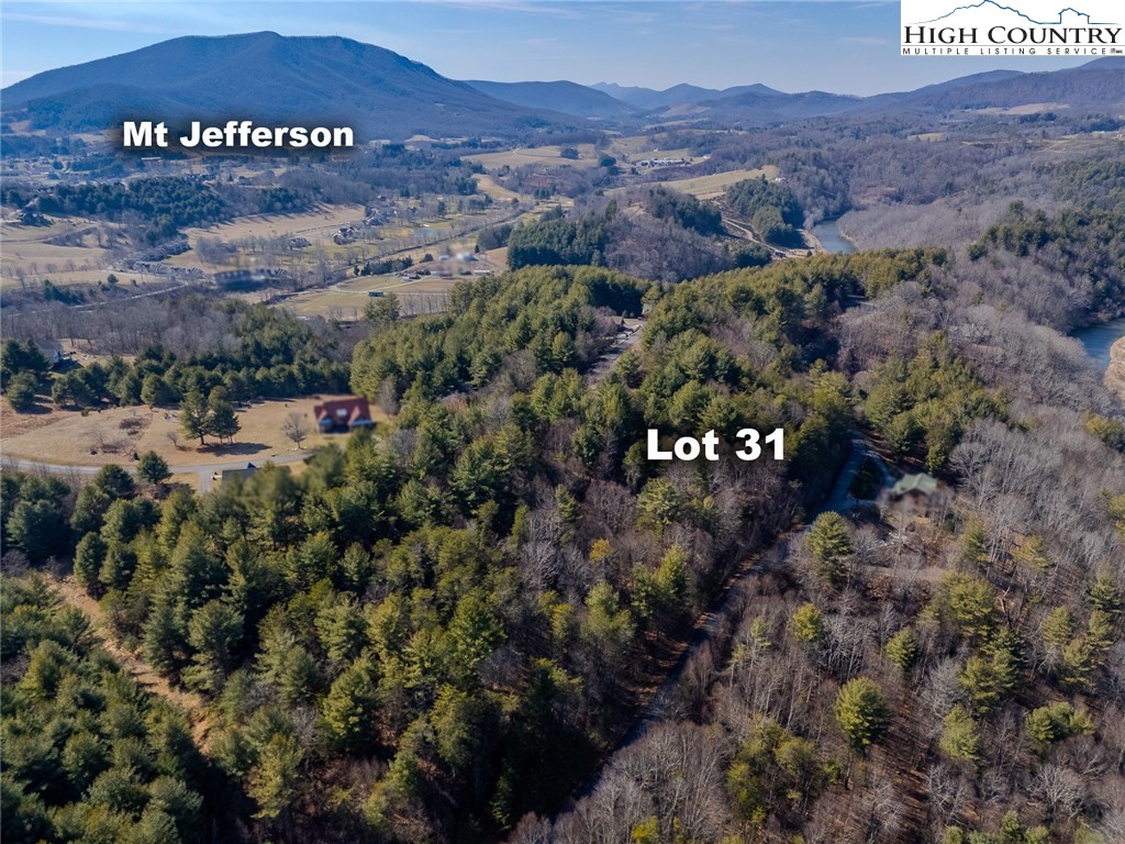 Shawnee Trail Jefferson, NC 28640 - Photo 4 of 24 a view of a big yard with an mountain