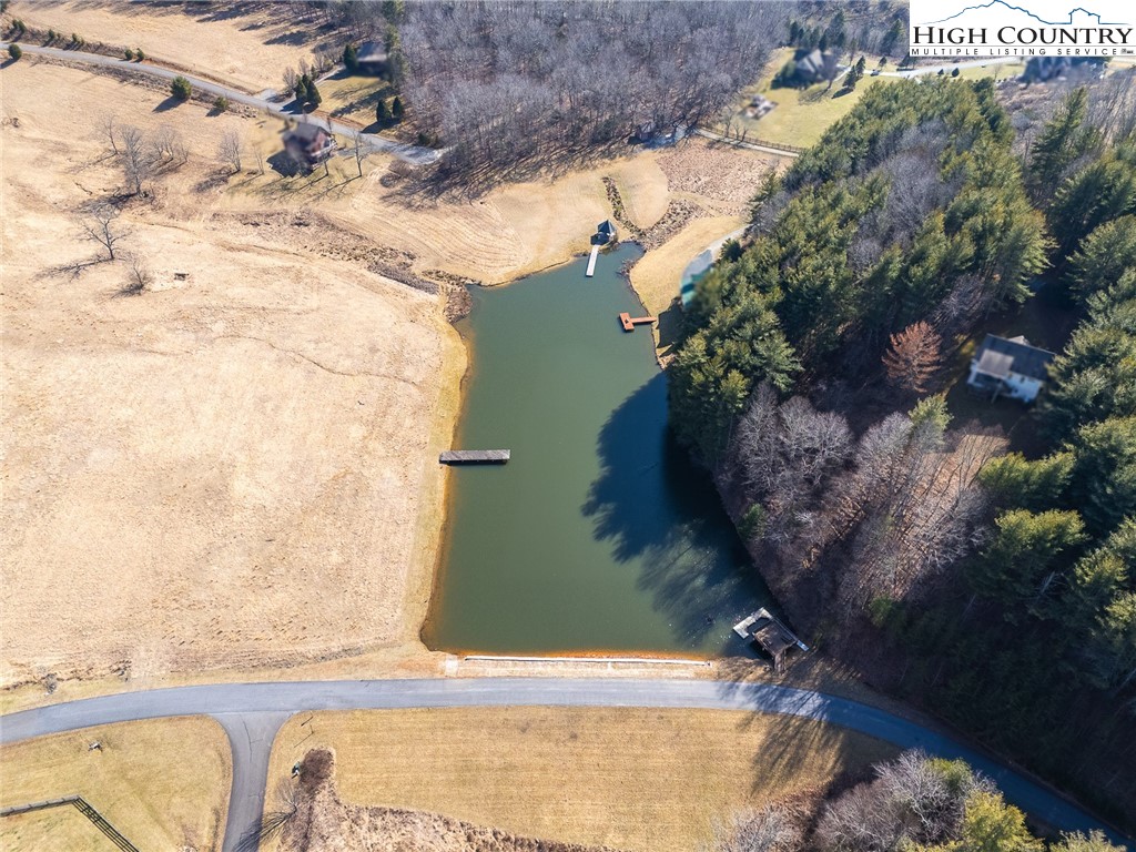 Shawnee Trail Jefferson, NC 28640 - Photo 9 of 24 a backyard of a house with lots of green space