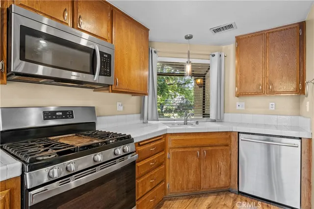 a kitchen with a stove and a microwave