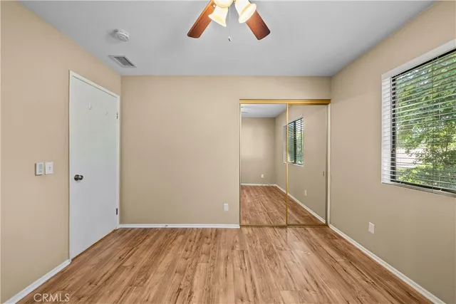 a bathroom with a sink toilet a mirror and shower