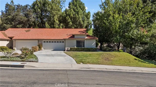 a house with yard in front of it