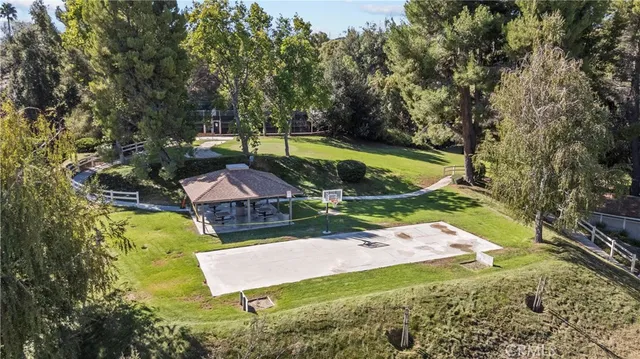 an aerial view of a house with outdoor space