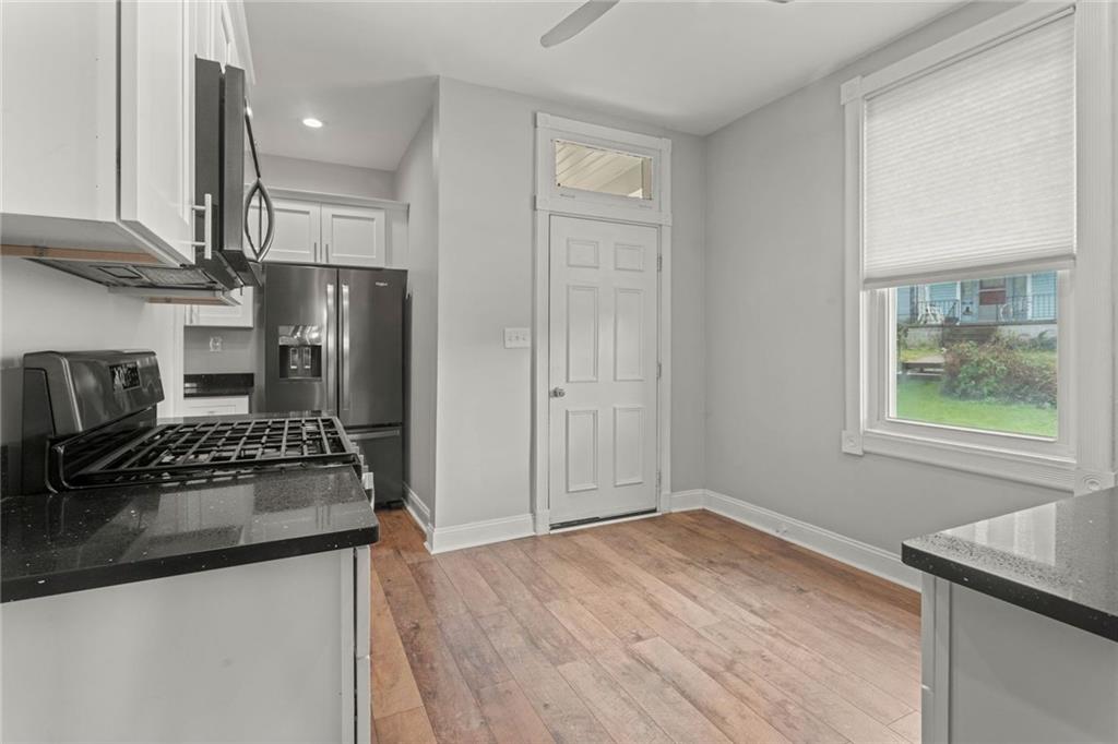 751 Florence Avenue Pittsburgh, PA 15202 - Photo 12 of 45 a kitchen with stainless steel appliances granite countertop a refrigerator and a stove top oven
