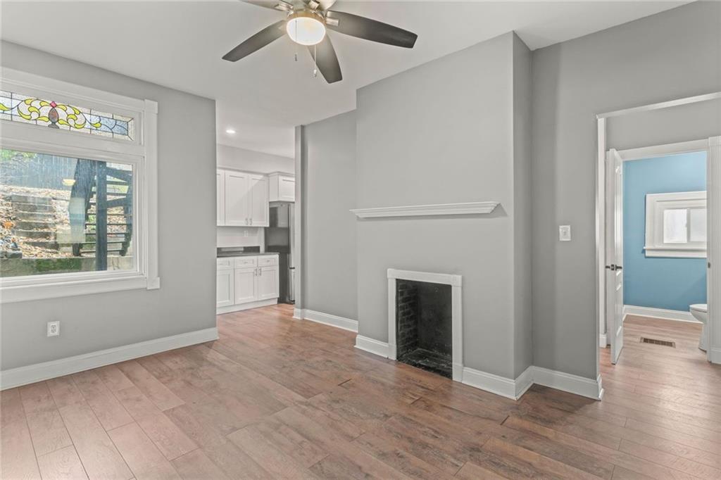 751 Florence Avenue Pittsburgh, PA 15202 - Photo 17 of 45 an empty room with wooden floor a ceiling fan and windows