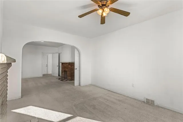 an empty room with a fireplace