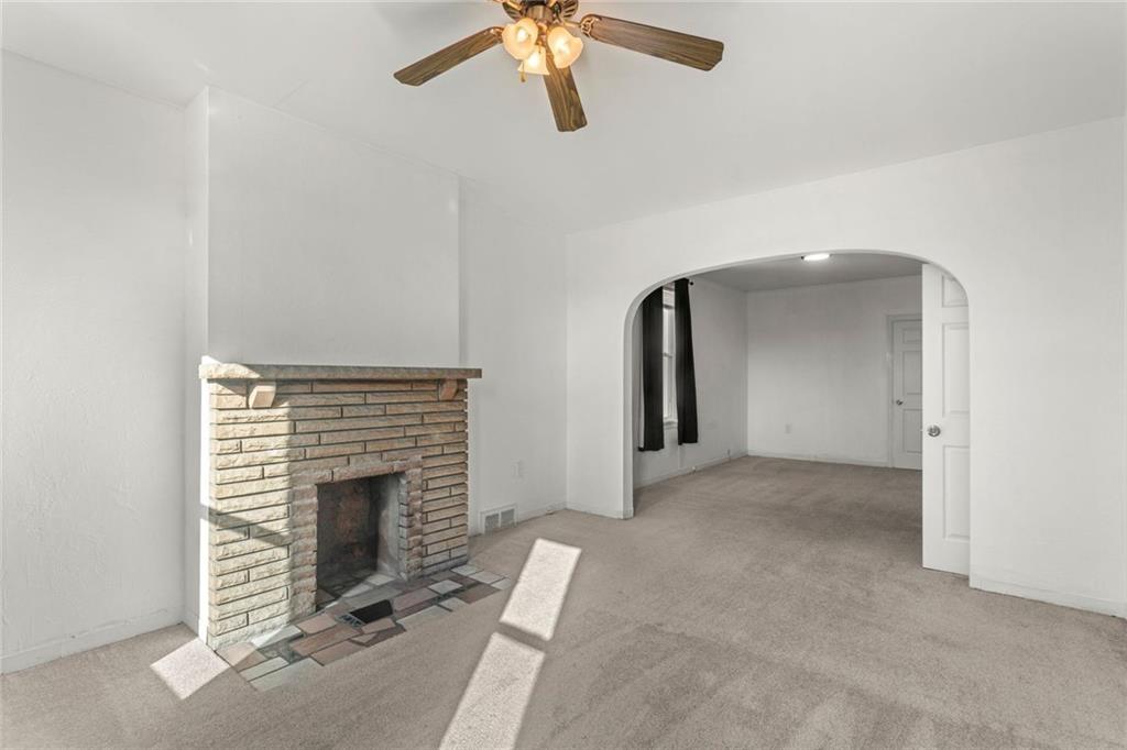 751 Florence Avenue Pittsburgh, PA 15202 - Photo 29 of 45 an empty room with a fireplace