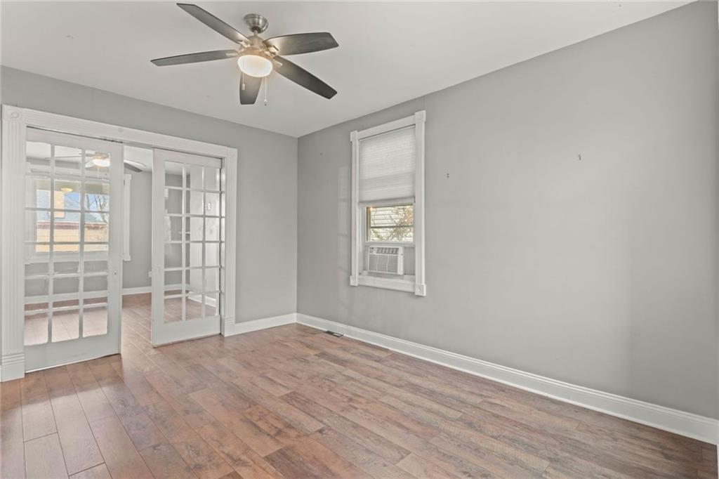 751 Florence Avenue Pittsburgh, PA 15202 - Photo 9 of 45 wooden floor in an empty room with a window