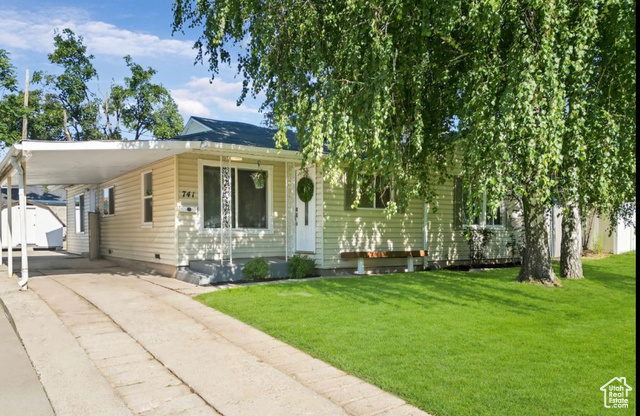 741 North 1050 E Street Provo, UT 84606 - Photo 1 of 1 View of front of house featuring a carport and a front lawn
