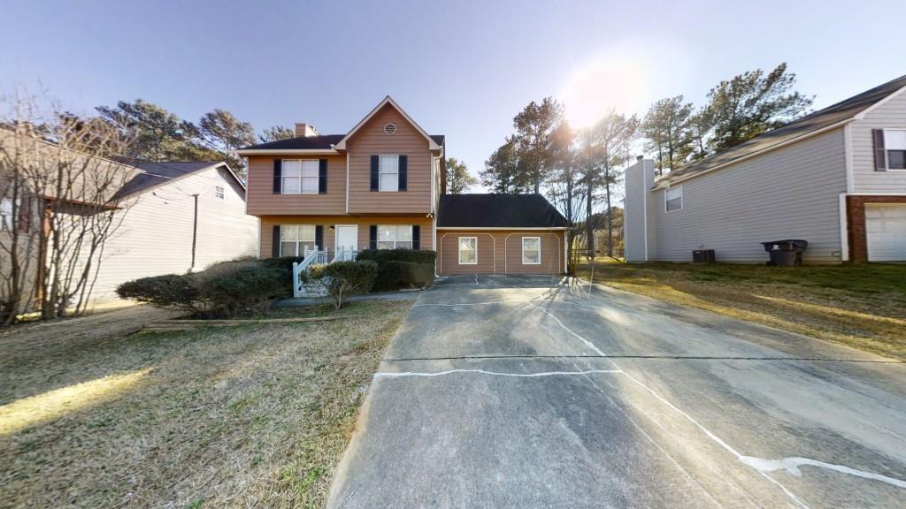 3053 Botany Drive Jonesboro, GA 30236 - Photo 1 of 13 a view of a house with a yard
