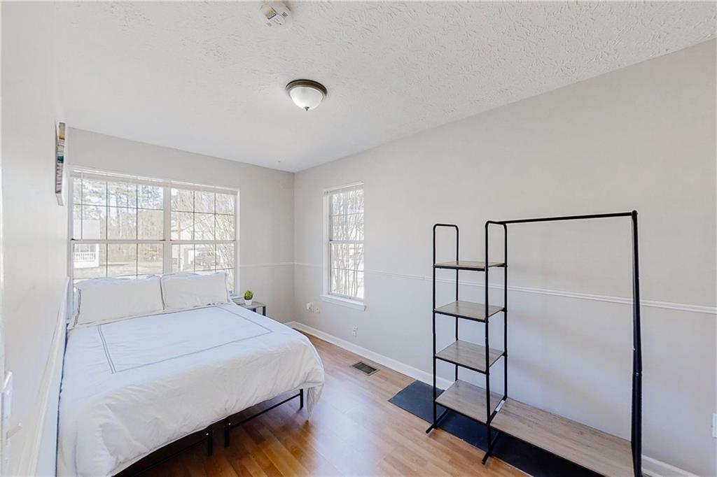 3053 Botany Drive Jonesboro, GA 30236 - Photo 12 of 13 a bedroom with a bed and a window