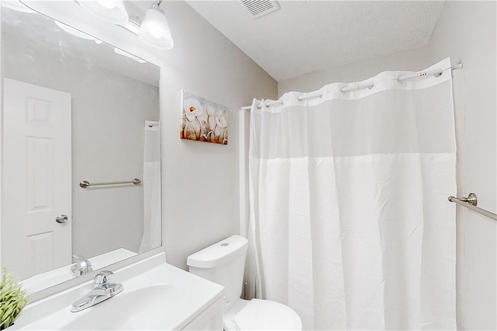 3053 Botany Drive Jonesboro, GA 30236 - Photo 7 of 13 a bathroom with a sink toilet and shower