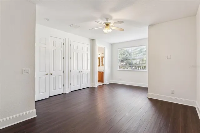 a bathroom with a double vanity sink toilet and shower