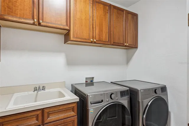 a bathroom with a granite countertop toilet a sink and mirror