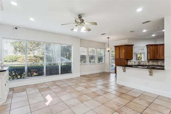 a kitchen with stainless steel appliances a refrigerator and a stove top oven