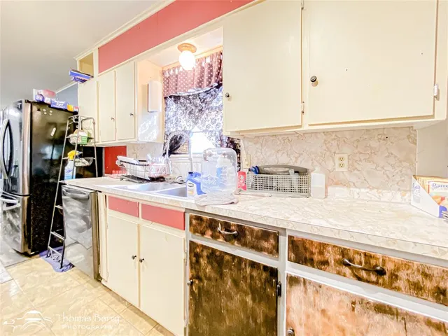 a kitchen with a stove and a microwave