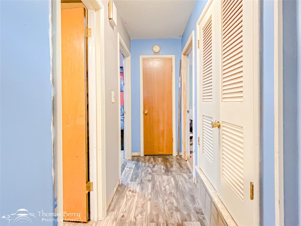 1029 Northwest 3rd Street Hamlin, TX 79520 - Photo 19 of 35 a view of a bathroom with a door