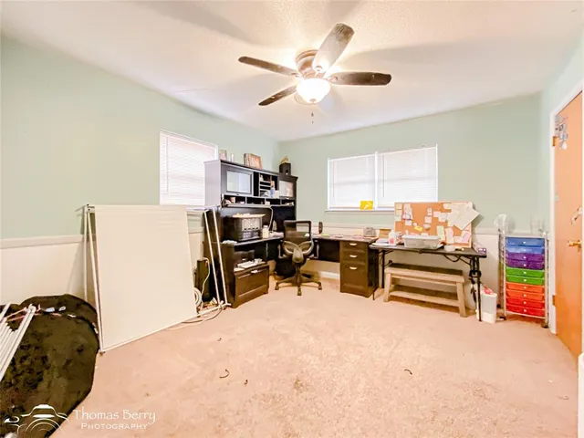 a workspace with furniture and a window