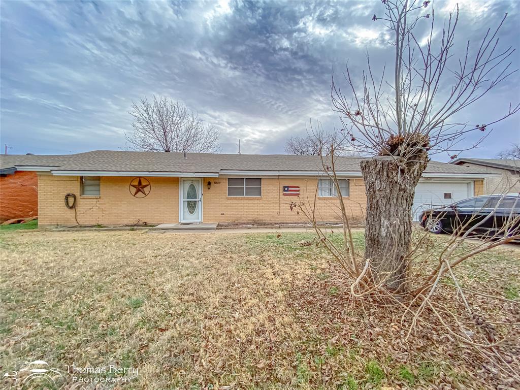 1029 Northwest 3rd Street Hamlin, TX 79520 - Photo 2 of 35 a view of a house with a yard