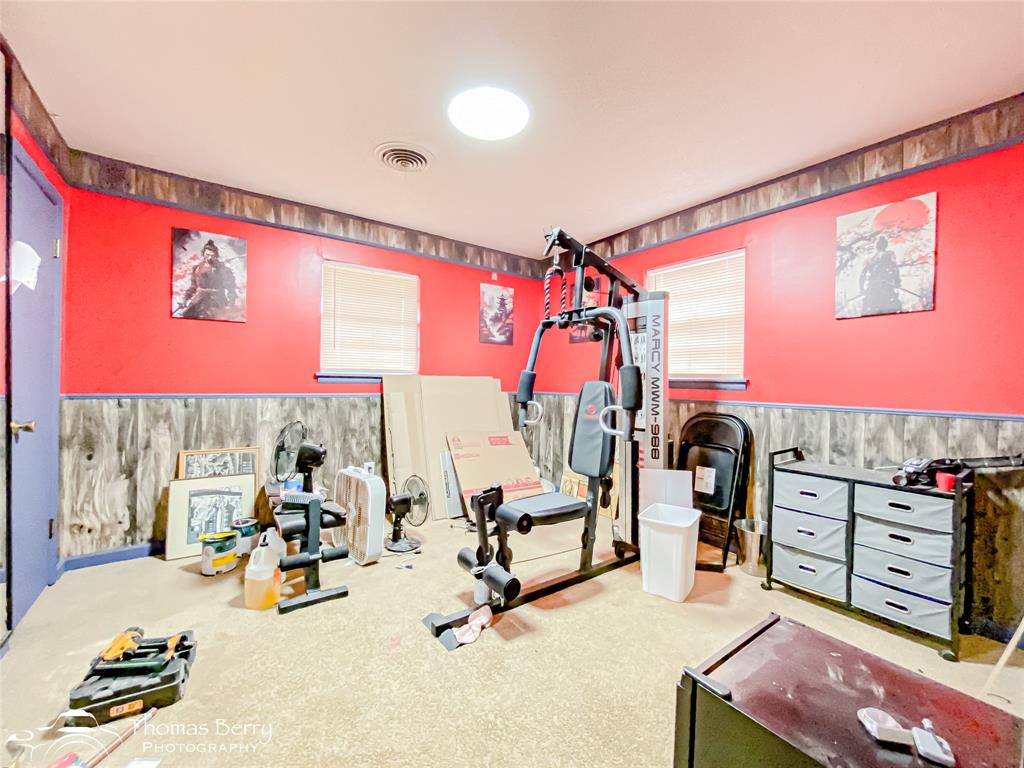 1029 Northwest 3rd Street Hamlin, TX 79520 - Photo 22 of 35 a view of a room with gym equipment