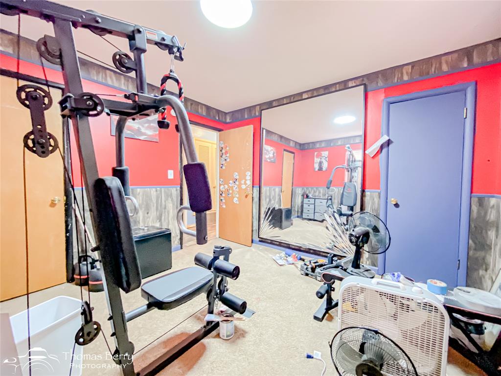 1029 Northwest 3rd Street Hamlin, TX 79520 - Photo 23 of 35 a view of a room with gym equipment