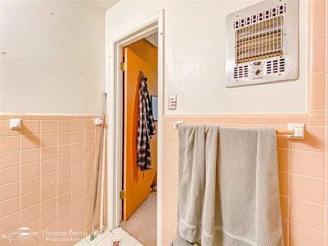 a view of a hallway with washer and dryer