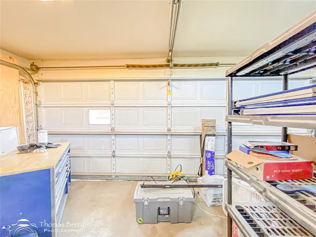 a view of a kitchen with dining area and windows