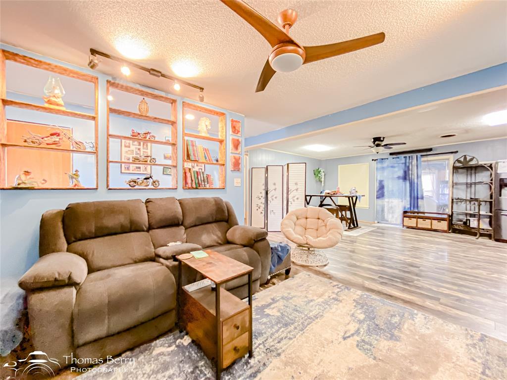 1029 Northwest 3rd Street Hamlin, TX 79520 - Photo 8 of 35 a living room with furniture and a large window