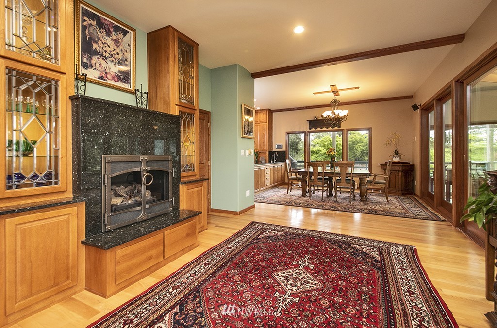 5741 Crow Haven Road Langley, WA 98260 - Photo 13 of 40 a living room with fireplace furniture and a rug