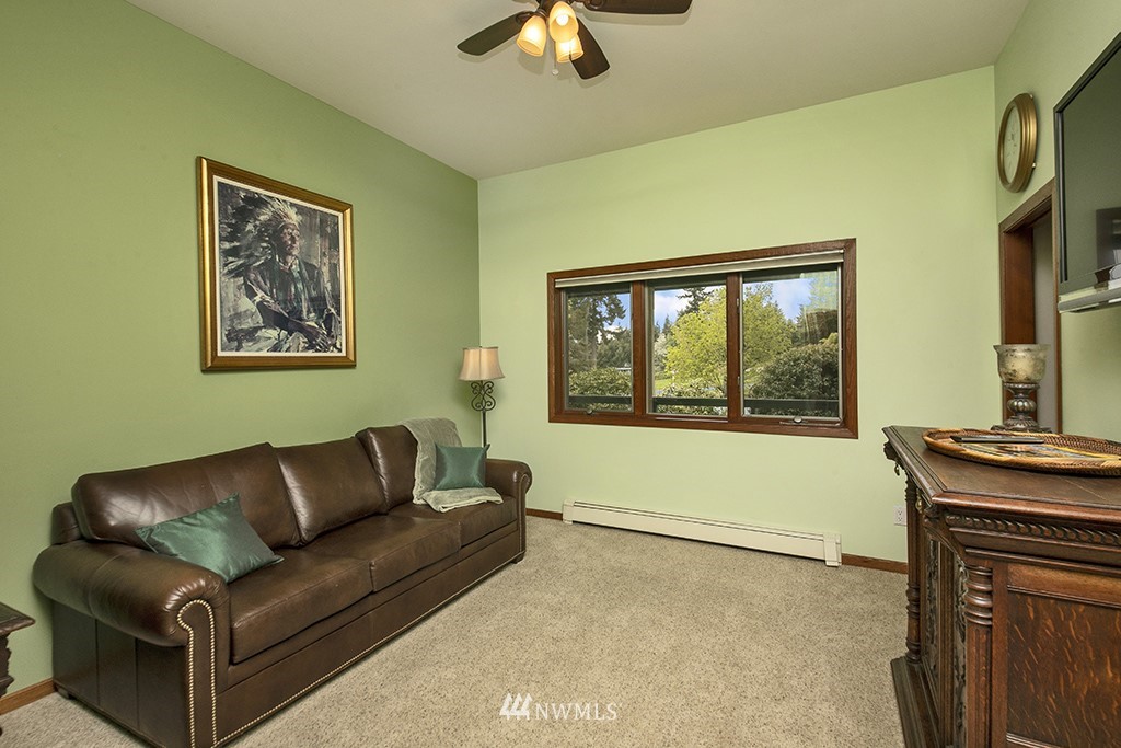 5741 Crow Haven Road Langley, WA 98260 - Photo 16 of 40 a living room with furniture and a window