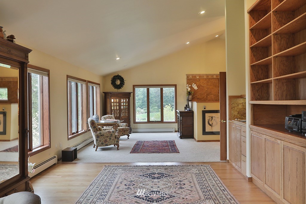 5741 Crow Haven Road Langley, WA 98260 - Photo 18 of 40 a living room with furniture and a rug