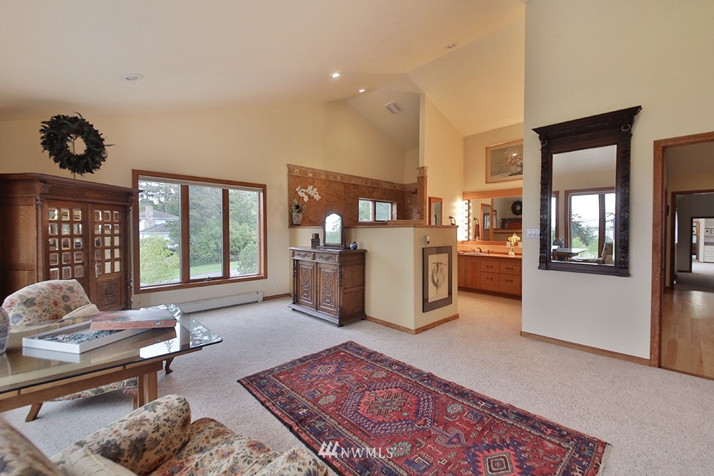 5741 Crow Haven Road Langley, WA 98260 - Photo 19 of 40 a living room with furniture rug and window