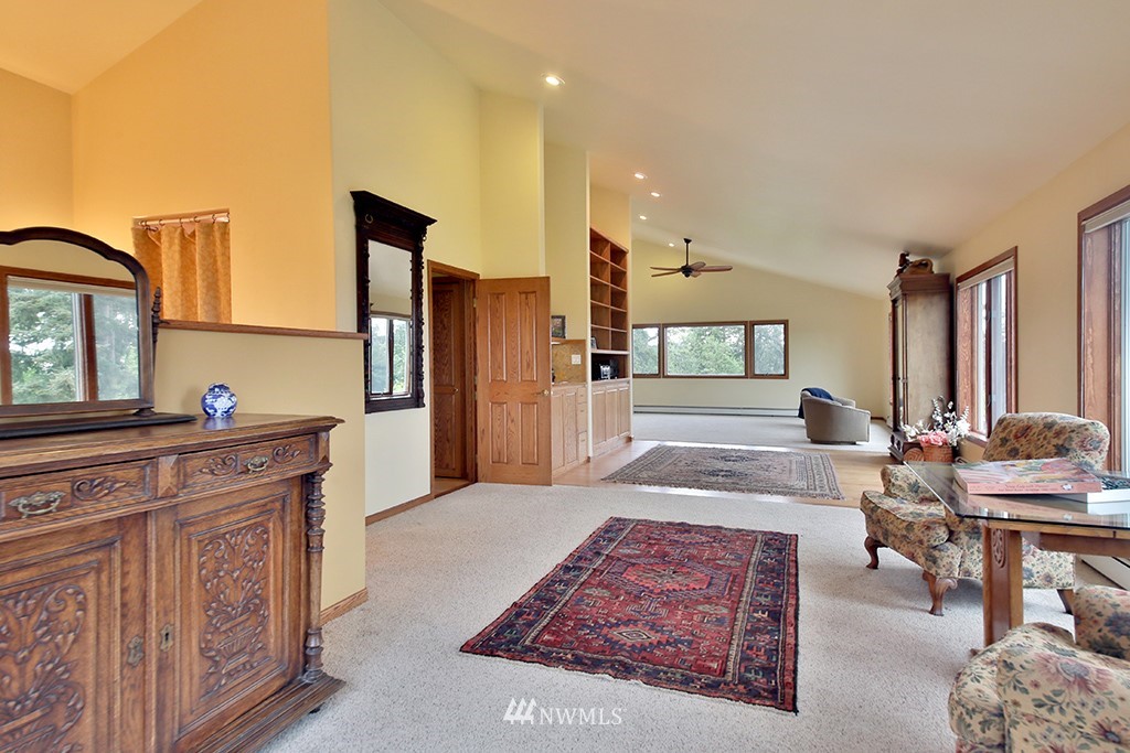 5741 Crow Haven Road Langley, WA 98260 - Photo 21 of 40 a very nice looking living room with a large window and wooden floor
