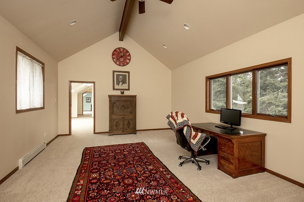 5741 Crow Haven Road Langley, WA 98260 - Photo 22 of 40 a view of a workspace with furniture and a window