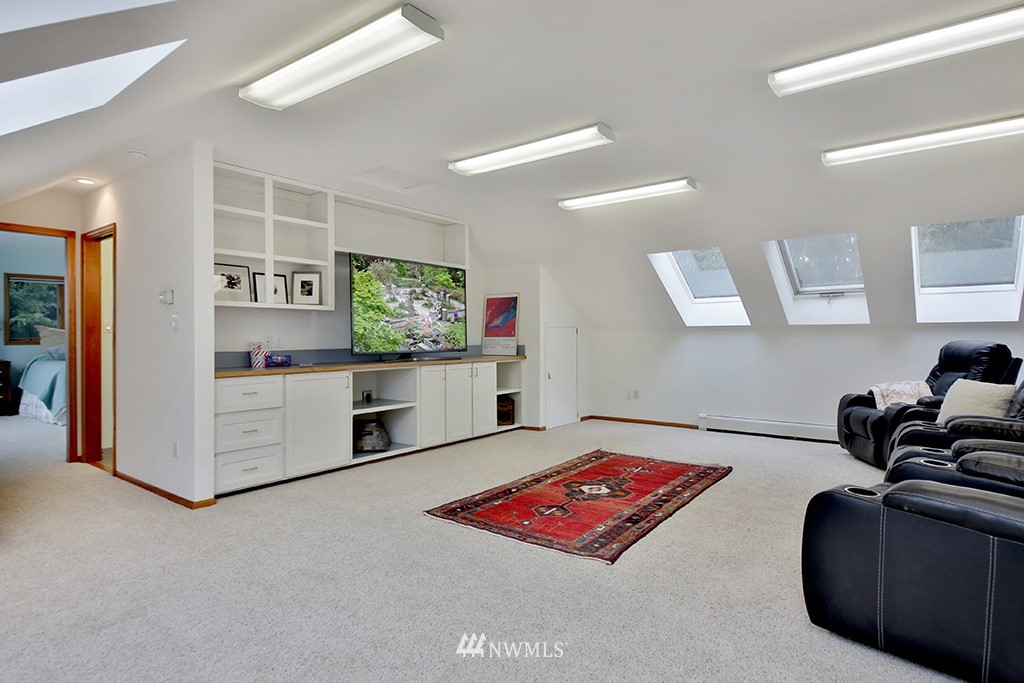 5741 Crow Haven Road Langley, WA 98260 - Photo 23 of 40 a living room with furniture and a flat screen tv