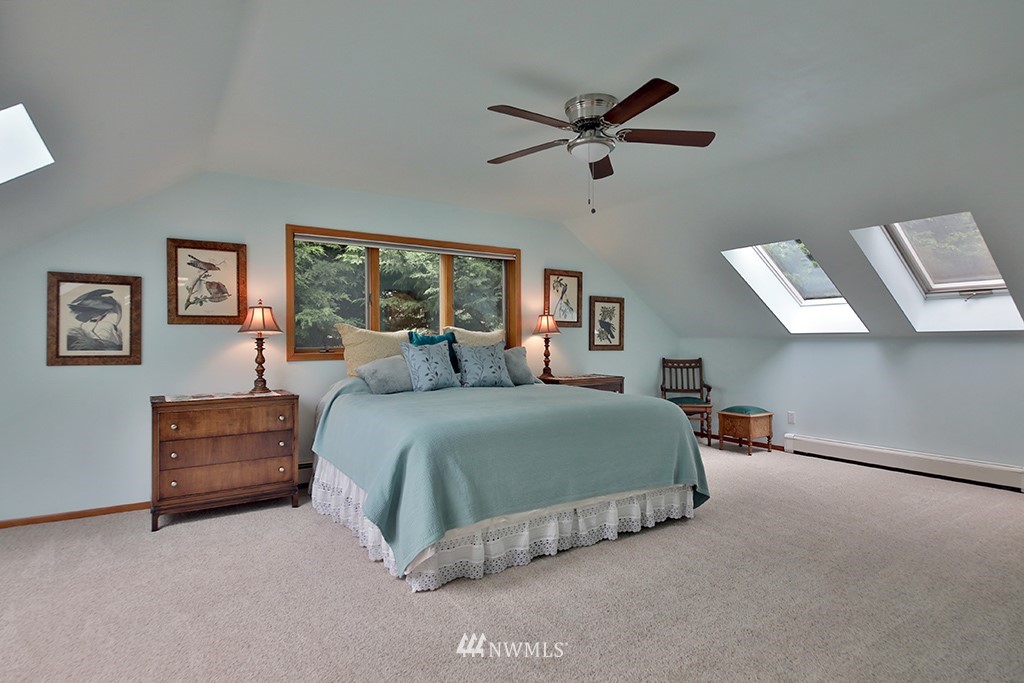5741 Crow Haven Road Langley, WA 98260 - Photo 24 of 40 a bedroom with a bed and window