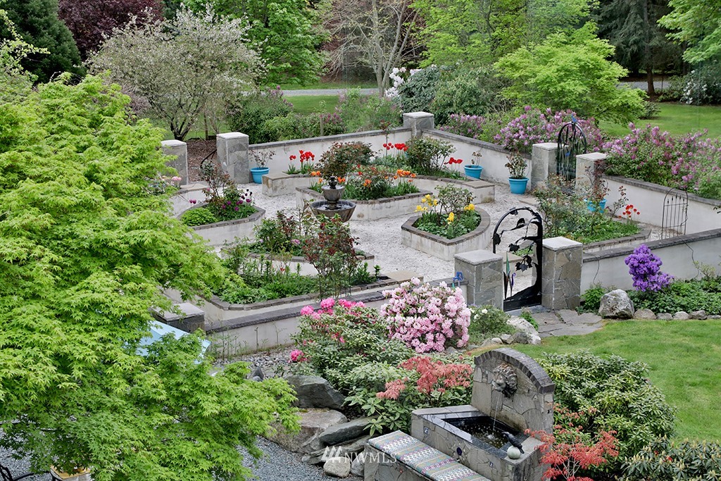 5741 Crow Haven Road Langley, WA 98260 - Photo 4 of 40 an aerial view of a house with a yard and garden