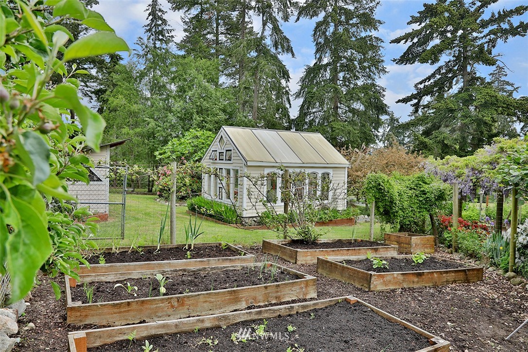 5741 Crow Haven Road Langley, WA 98260 - Photo 33 of 40 a view of a house with a yard and tree s