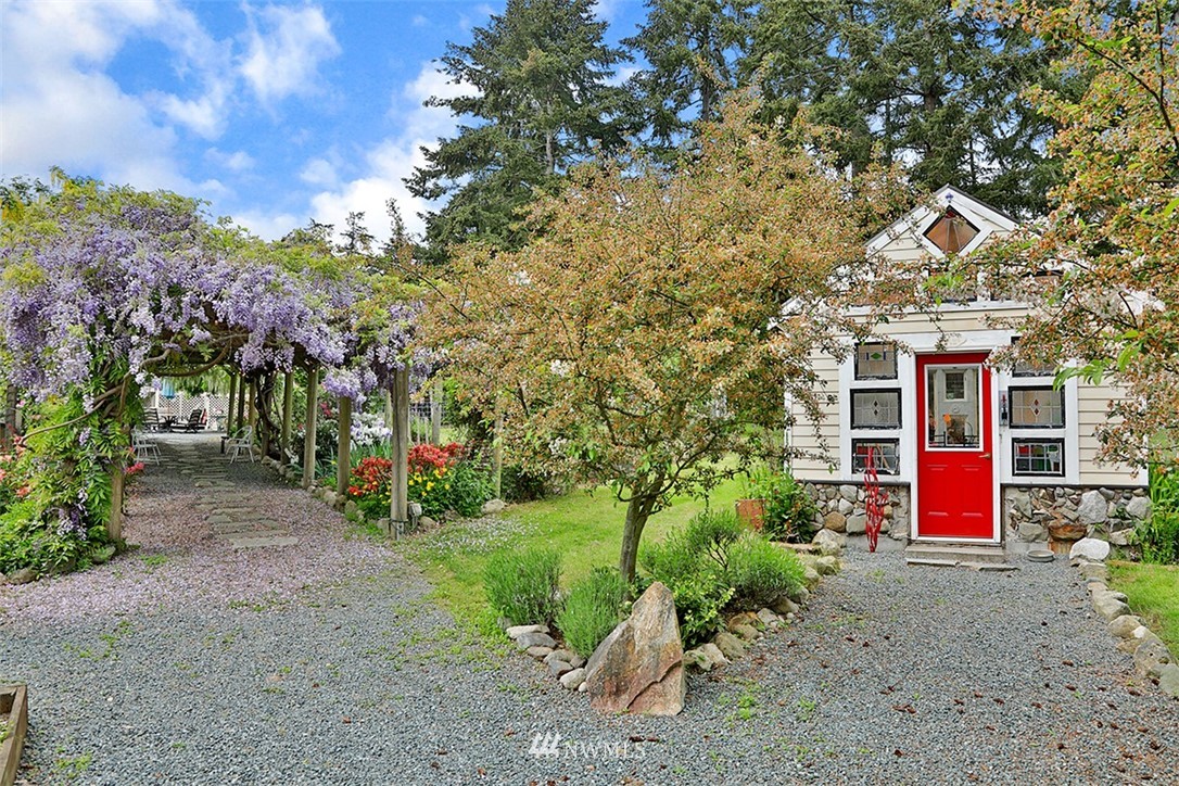 5741 Crow Haven Road Langley, WA 98260 - Photo 34 of 40 a view of a house with a yard and tree s