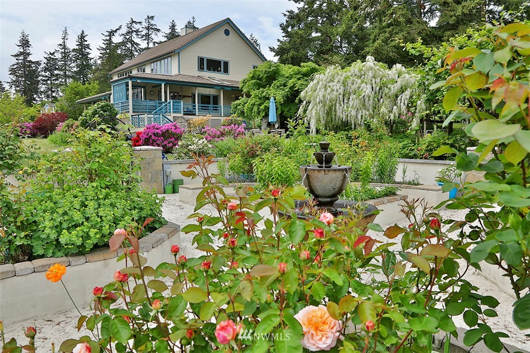 5741 Crow Haven Road Langley, WA 98260 - Photo 5 of 40 a front view of a house with a yard and garden