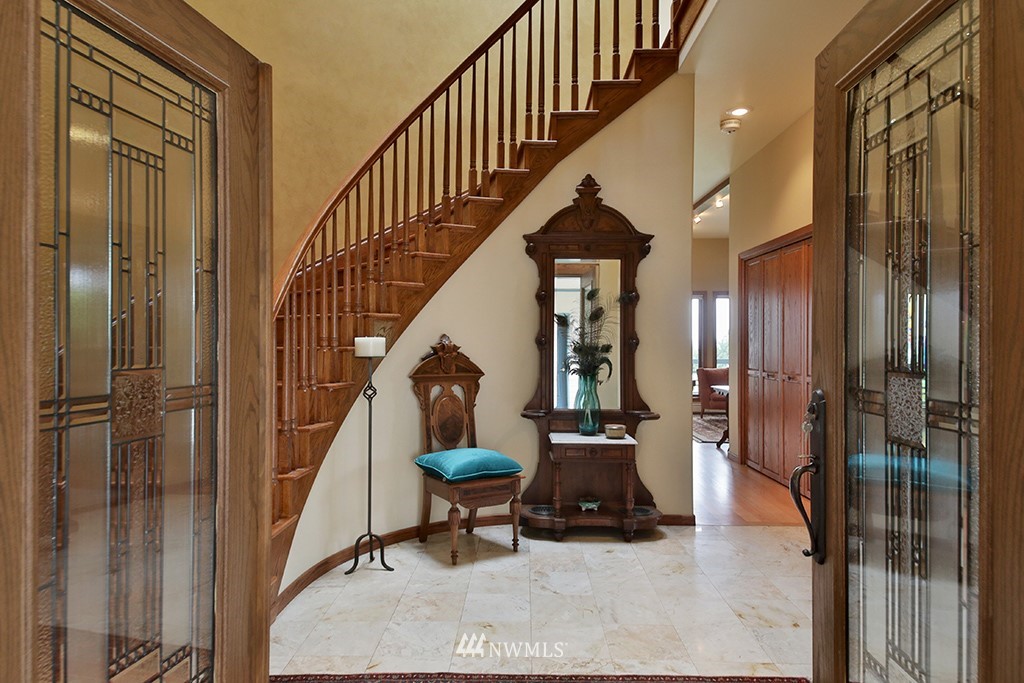 5741 Crow Haven Road Langley, WA 98260 - Photo 8 of 40 a living room with furniture and a staircase