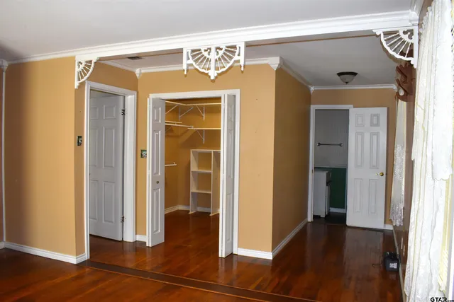 a view of a room with wooden walls