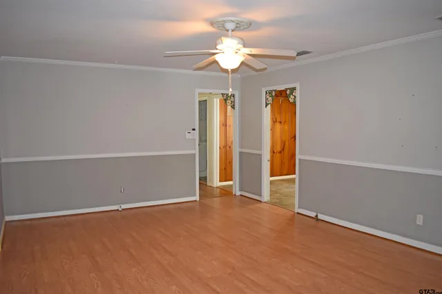 a living room with furniture a rug and a fireplace
