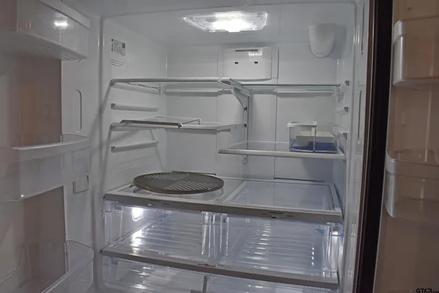 a dining room with furniture and chandelier