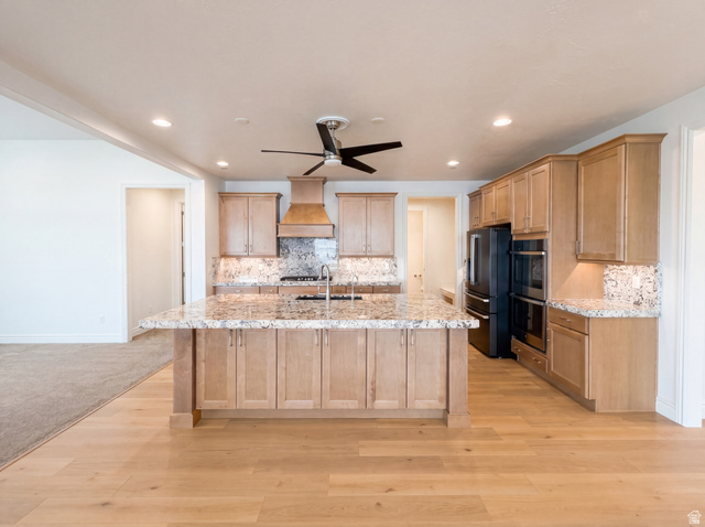 1251 North 2525 West Clinton, UT 84015 - Photo 2 of 30 Expansive kitchen featuring light wood-finish cabinetry, granite countertops, and a substantial island with a stainless steel sink
