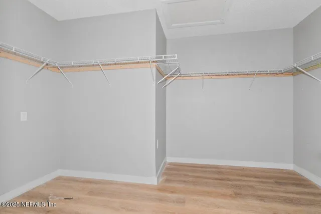 a view of an empty walk in closet