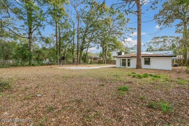 a backyard of a house with lots of green space