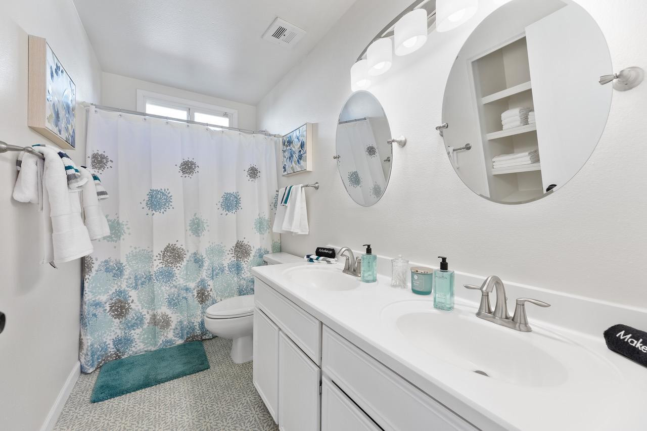 8307 East Arlington Road Scottsdale, AZ 85250 - Photo 17 of 25 a bathroom with a sink a toilet and a mirror